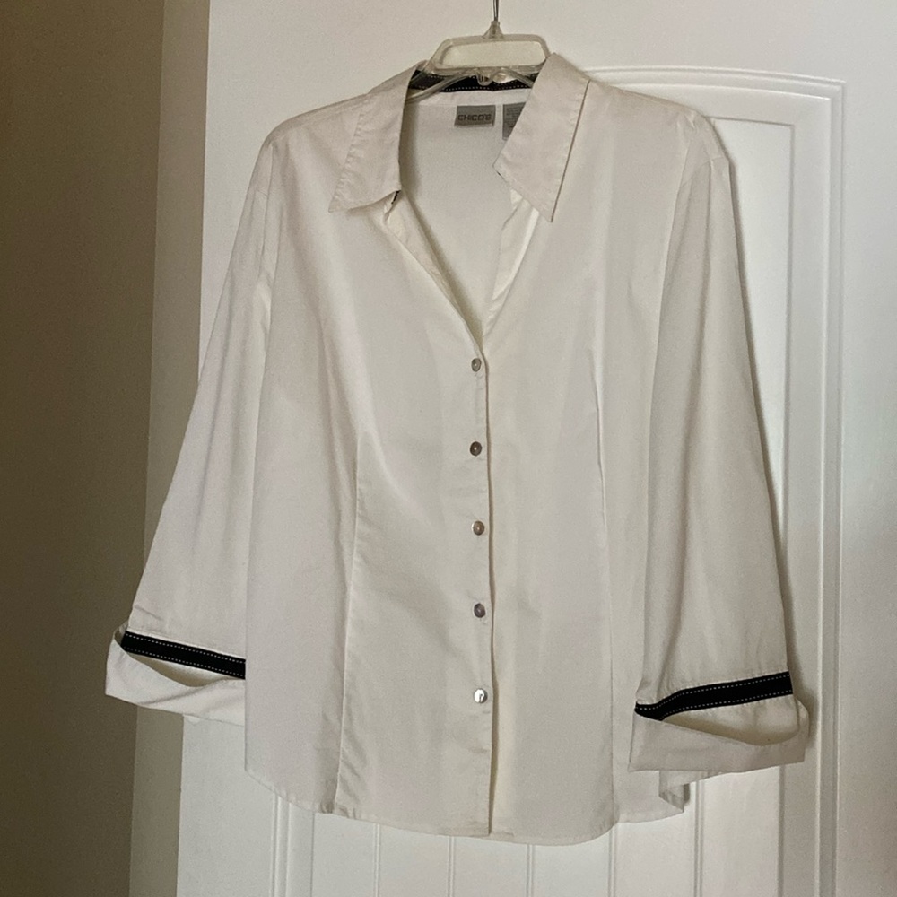 White blouse black trim detail